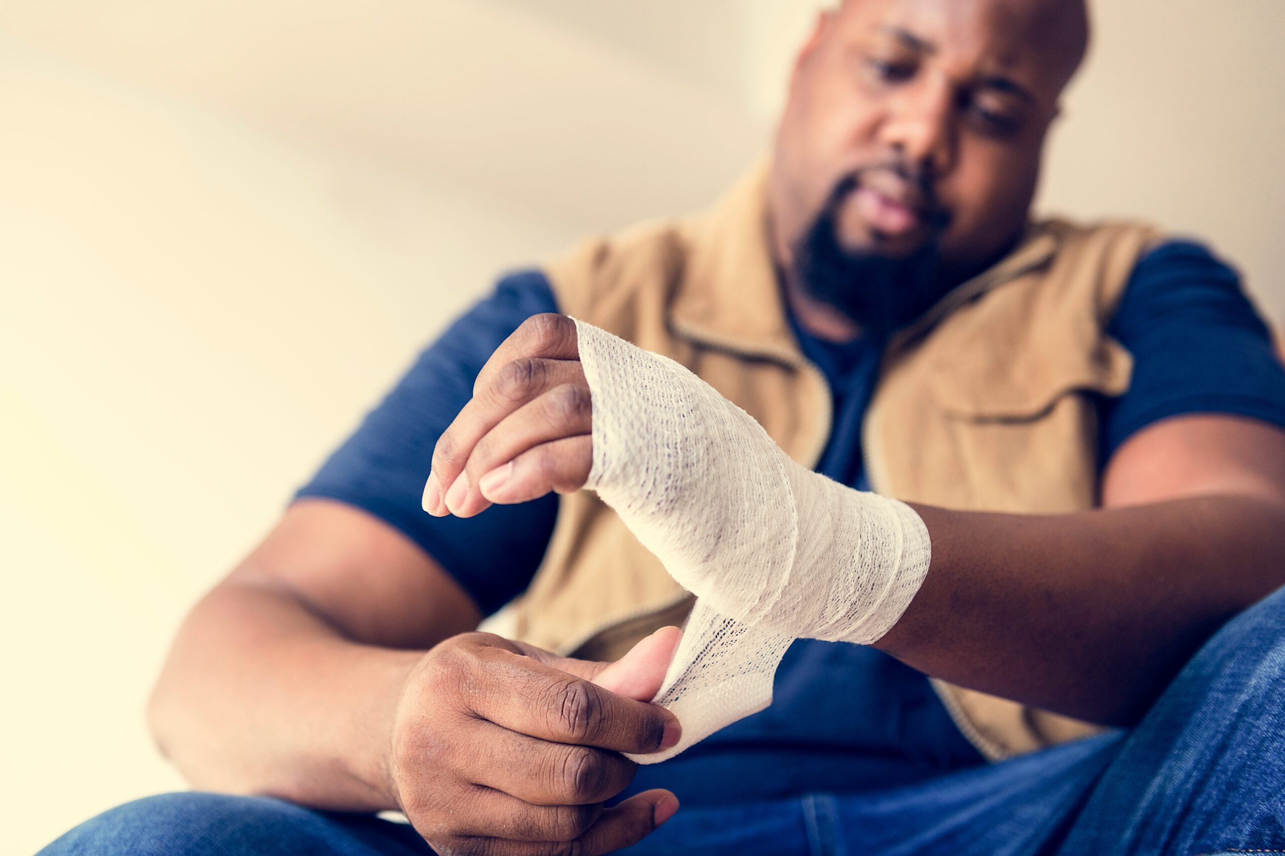 Image of a man wrapping his hand from a personal injury